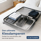 Rennoa QuickSteamer tøjdamper i en åben kuffert med foldet tøj – Den ultimative tøjdamper, 4,7 på Trustpilot